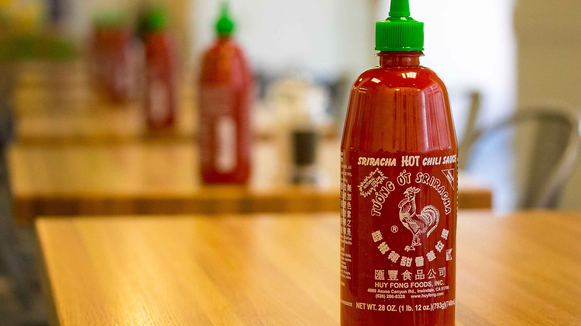 My baby a big bottle of Sriracha